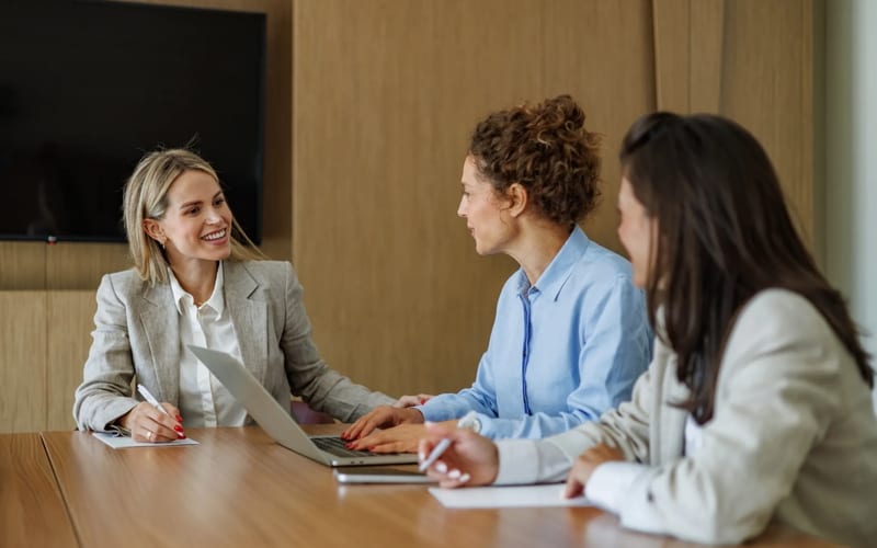 Two women in a warm, supportive conversation